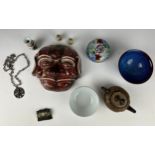 A COLLECTION OF CHINESE ITEMS TO INCLUDE A YI XING TEA POT, mask of a man, small bottles and bowls.