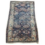 AN ANTIQUE PERSIAN KILIM RUG, Faded and worn. 205cm x 130cm