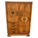 AN ART DECO BURR WALNUT CABINET, with six inner compartments, one with two sliding drawers 124cm x