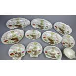 A WEDGWOOD SHELL DESIGN PART DINNER SERVICE IN THE JAPANESE STYLE, painted with flowers and rocky