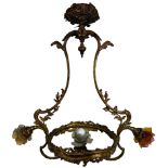 AN ART NOUVEAU HEAVY BRASS CHANDELIER OF THREE BRANCHES WITH COLOURED GLASS FOLIATE SHADES, and