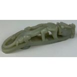 A CHINESE JADE BRUSH DEPICTING A FOUR LEGGED CREATURE, probably 19th Century.