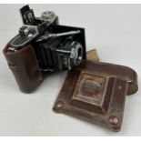 A ZEISS-IKON SUPER IKONTA 531 CAMERA 6 X 4.5CM CIRCA 1948 WITH OPTON-TESSAR 75MM LENS, Lens in brown