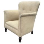 A CONTEMPORARY ARMCHAIR BUTTON BACK UPHOLSTERED IN OATMEAL NEUTRAL FABRIC, raised on turned legs