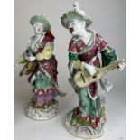 A PAIR OF ROYAL VIENNA 'MALABAR MUSICIANS', playing instruments, marked underneath with Royal Vienna