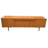 A MID CENTURY TEAK SIDEBOARD, four opening compartments and two central drawers. The compartments