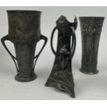 A GROUP OF THREE ART NOUVEAU PEWTER VESSELS, including a twin handled cup (3) 20cm in height