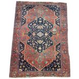 AN ANTIQUE PERSIAN RUG, floral design 186cm x 136cm