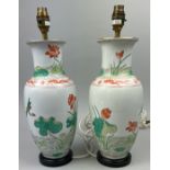 A PAIR OF CHINESE PORCELAIN VASES ADAPTED INTO LAMPS, hand painted depicting cranes and lily pads (