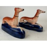 A PAIR OF STAFFORDSHIRE GREYHOUND INKWELLS (2) 18cm in length