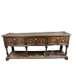 A CHARLES II DRESSER OAK DRESSER BASE CIRCA 1690, possibly later additions, The rectangular plank