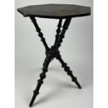 A VICTORIAN EBONISED SIDE TABLE WITH UNUSUAL TRIPOD SUPPORTS AND BASE 65cm in height x 45cm in width