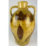 A LARGE YELLOW GLAZED ITALIAN TERRACOTTA VASE WITH PAINTED LEAF AND FERN DESIGN, Various repairs