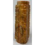 A CHINESE HARDSTONE OR JADE TALL VESSEL OF ARCHAIC FORM, incised with various symbols and marks.