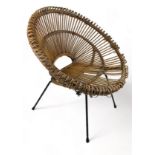 A MID CENTURY RATTAN AND METAL CHAIR IN THE MANNER OF FRANCO ALBINI (1905-1977)
