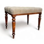 A VICTORIAN HEARTH STOOL WINDOW SEAT, button back neutral upholstered seat raised on four turned