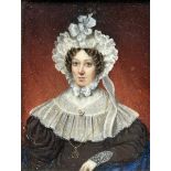 A PORTRAIT MINIATURE WATERCOLOUR ON IVORY DEPICTING A LADY, Painted in the Georgian manner. The lady