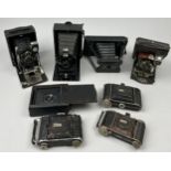 A COLLECTION OF EIGHT DECORATIVE VINTAGE CAMERAS