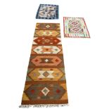 A COLLECTION OF THREE KILIM RUGS (3)