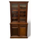 A VICTORIAN MAHOGANY BOOKCASE, The upper section consisting of two glazed doors with four inner