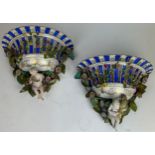 A PAIR OF DECORATIVE FLOWER BASKETS, each with porcelain basket decorated with toleware flowers
