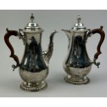 A GEORGE V SILVER COFFEE POT AND HOT WATER JUG, each having a gadroon rim and pineapple finial each