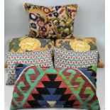 A COLLECTION OF SIX CUSHIONS, to include two made from fabric purchased from textile dealer Su