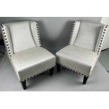 A PAIR OF SIDE CHAIRS UPHOLSTERED IN CONTEMPORARY NEUTRAL STUDDED FABRIC, 85cm H Each raised on four