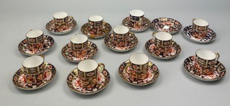 A ROYAL CROWN DERBY 2451 COFFEE SET, Consisting of eleven coffee cups and saucers, along with one