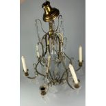 A BRASS AND GLASS CHANDELIER,