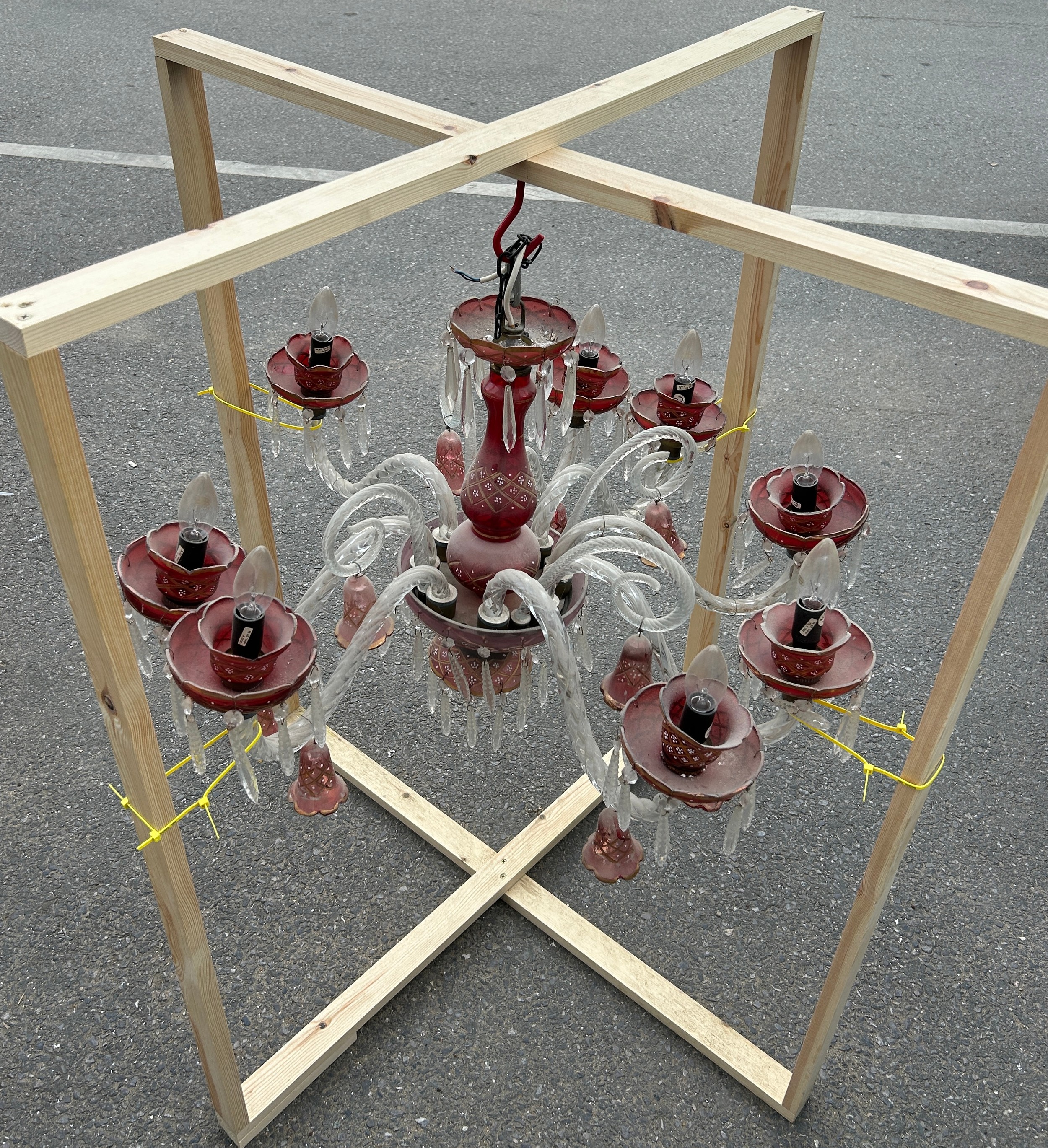 A BOHEMIAN RED CRYSTAL AND MURANO GLASS EIGHT ARM CHANDELIER, Some spare glass shades. 50cm drop