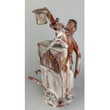 AN EARTHENWARE ORGAN GRINDER AND MONKEY ORNAMENT 32cm H