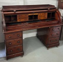 A LARGE 19TH CENTURY CUBAN MAHOGANY ROLL TOP DESK, The roll top opening to reveal a fitted