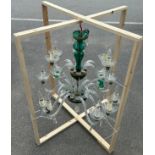 A BOHEMIAN GREEN CRYSTAL AND MURANO GLASS TWELVE ARM CHANDELIER, With damages. 85cm drop