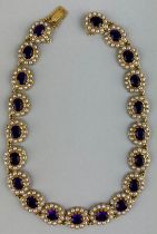 A LARGE VICTORIAN 9CT GOLD AMETHYST AND SEED PEARL NECKLACE, Twenty individual clusters of amethysts