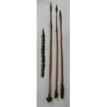 A GROUP OF TRIBAL SPEARS, including one barbed ceremonial spear head possibly from the Tiwi