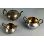 A SILVER AND GILT TEA SET BY ROBERT GARRARD II GIFTED FROM THE ATHENEUM CLUB IN PALL MALL TO THE