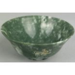 AN OTTOMAN JADE DISH WITH FLARED RIM AND CIRCULAR FOOT, Engraved with Islamic text to one side,