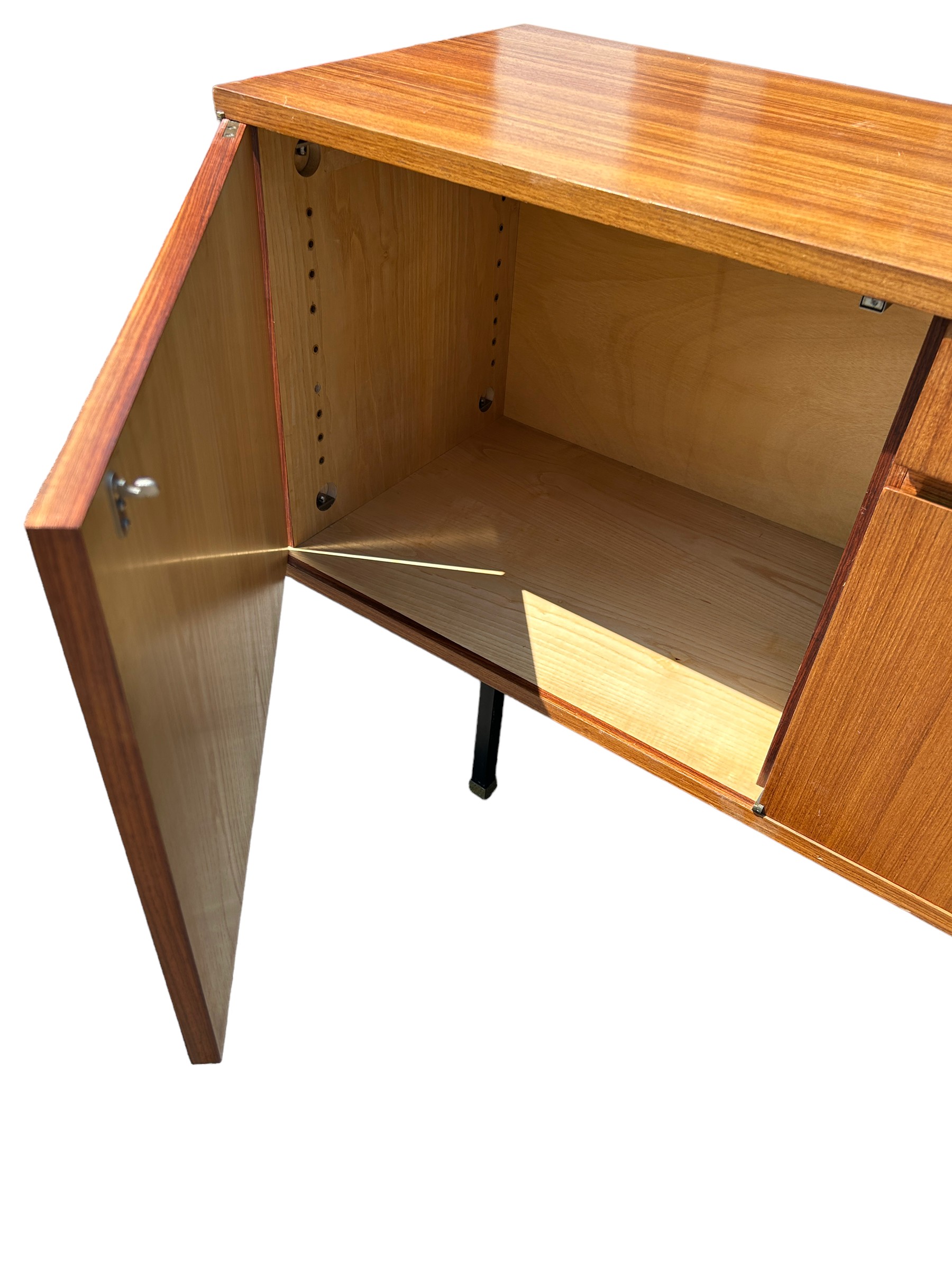 A MID CENTURY TEAK SIDEBOARD, four opening compartments and two central drawers. The compartments - Image 8 of 10