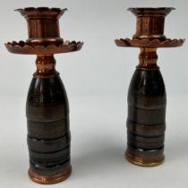 A PAIR OF 'TRENCH ART' COPPER CANDLESTICKS, 15cm in height each.