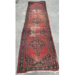 AN ANTIQUE PERSIAN RUG