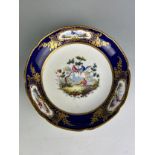 A SEVRES PORCELAIN DISH CIRCA 1900, Gilt decorated and painted with pheasants. 21cm D