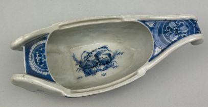 A JAPANESE PORCELAIN SAUCEBOAT, Blue and white painted with waves and crabs 23cm x 9cm