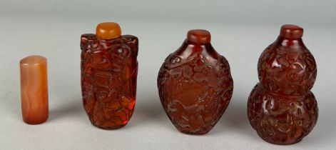 A COLLECTION OF THREE AMBER STYLE SNUFF BOTTLES AND TOPS, along with a small stone cylinder (4) 20th