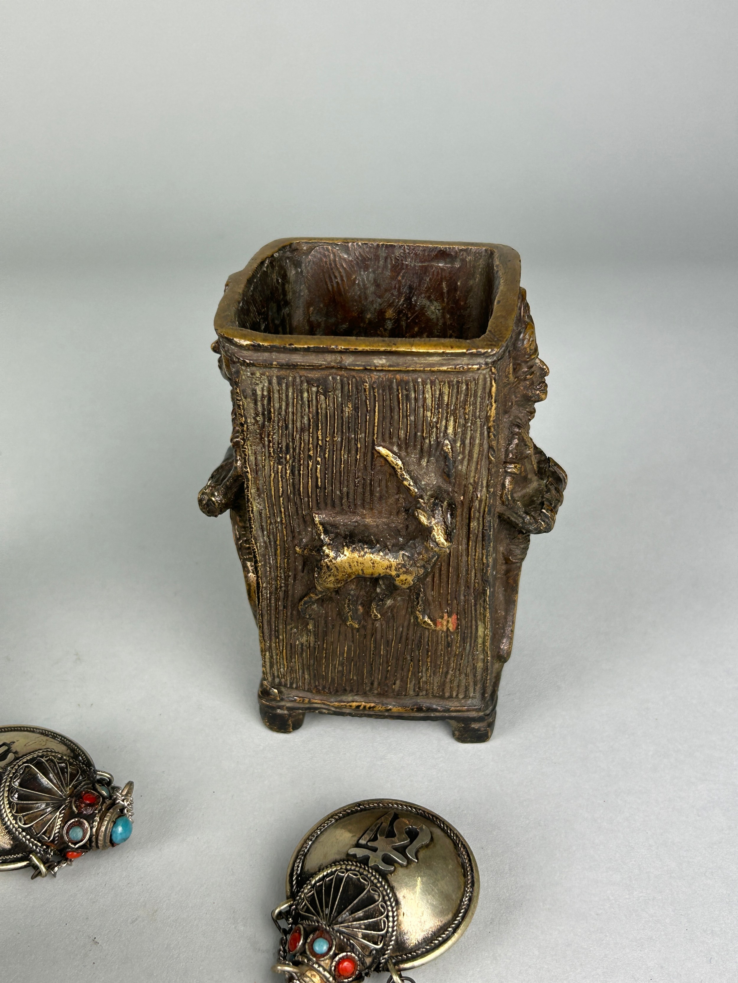 A COLLECTION OF ISLAMIC WHITE METAL AND COLOURED STONE CHARMS, along with a Benin bronze pot (Qty) - Image 3 of 4