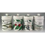 A SET OF FOUR CERAMIC FORNASETTI JARS, Each 18cm x 11cm For coffee, rice, sugar and tea (one