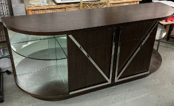 A CONTEMPORARY DESIGNER BAR, with polished steel arrow design doors, drawers, glass shelves and