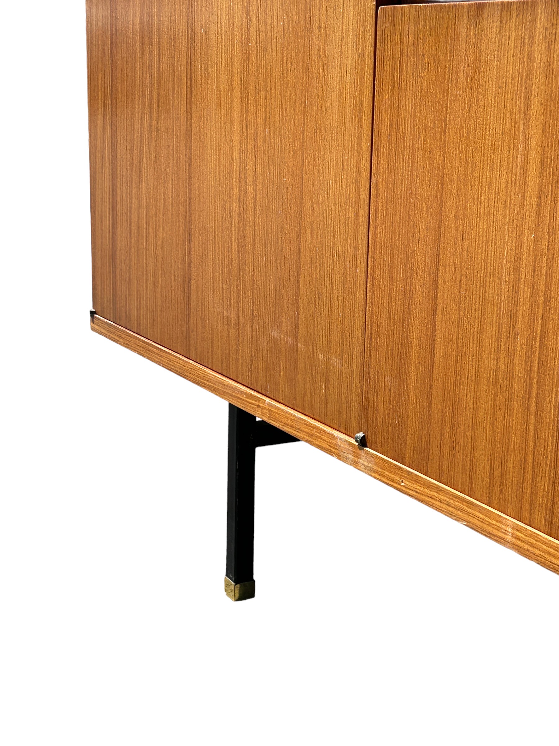 A MID CENTURY TEAK SIDEBOARD, four opening compartments and two central drawers. The compartments - Image 9 of 10