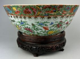 A 19TH CENTURY CHINESE EXPORT FAMILLE-VERTE PUNCH BOWL, Painted with flowers and butterflies.