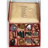 A SMALL COLLECTION OF MINERALS IN AN ANTIQUE BOX, To include Amethyst, Rockcristal, Hematite,